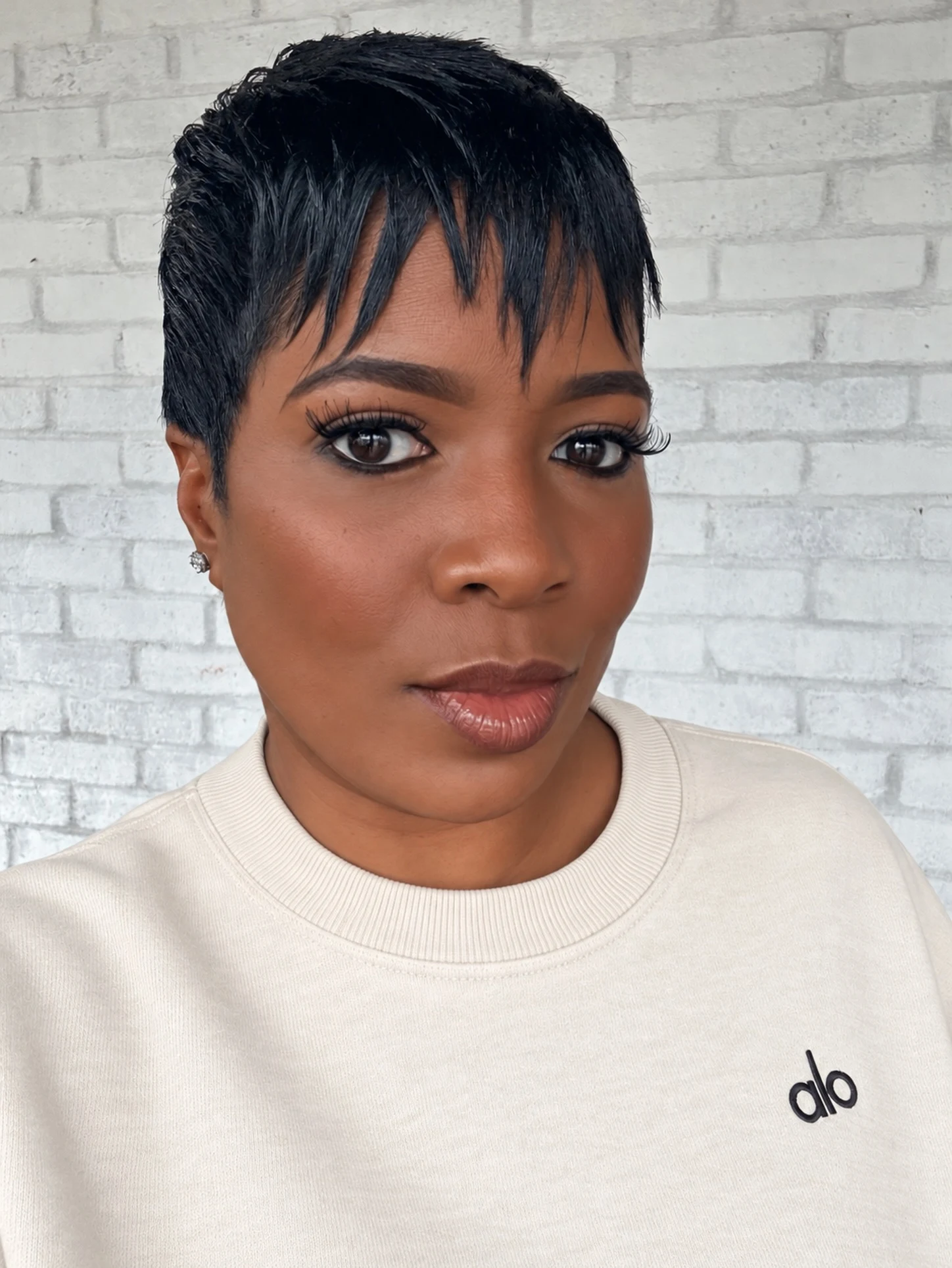 Textured crop with a short choppy fringe on a woman with dark hair