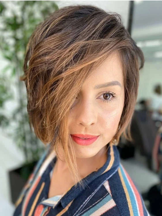 Asymmetric bob with longer front pieces sweeping across one side