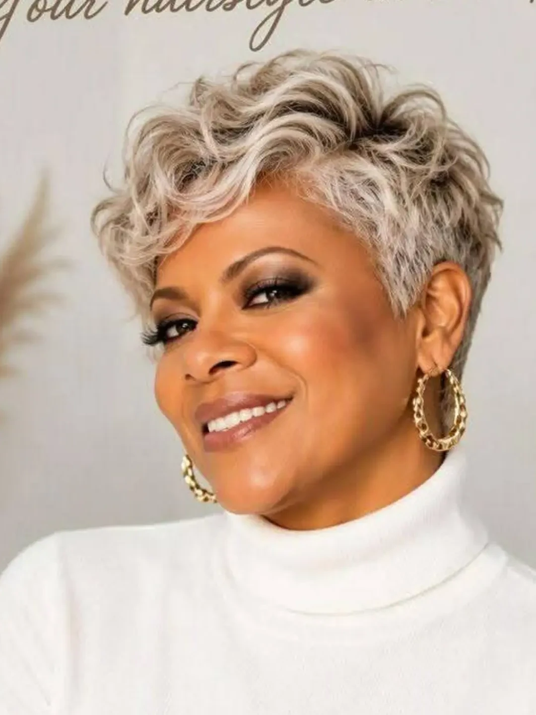 Curly silver pixie cut with volume on top on a smiling woman