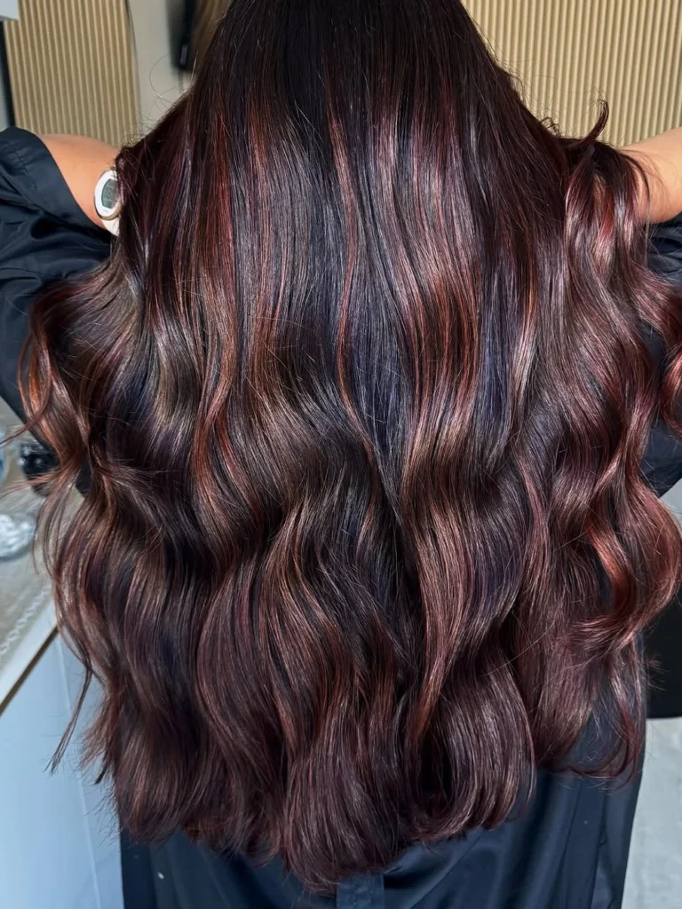 Dark hair with copper red balayage highlights
