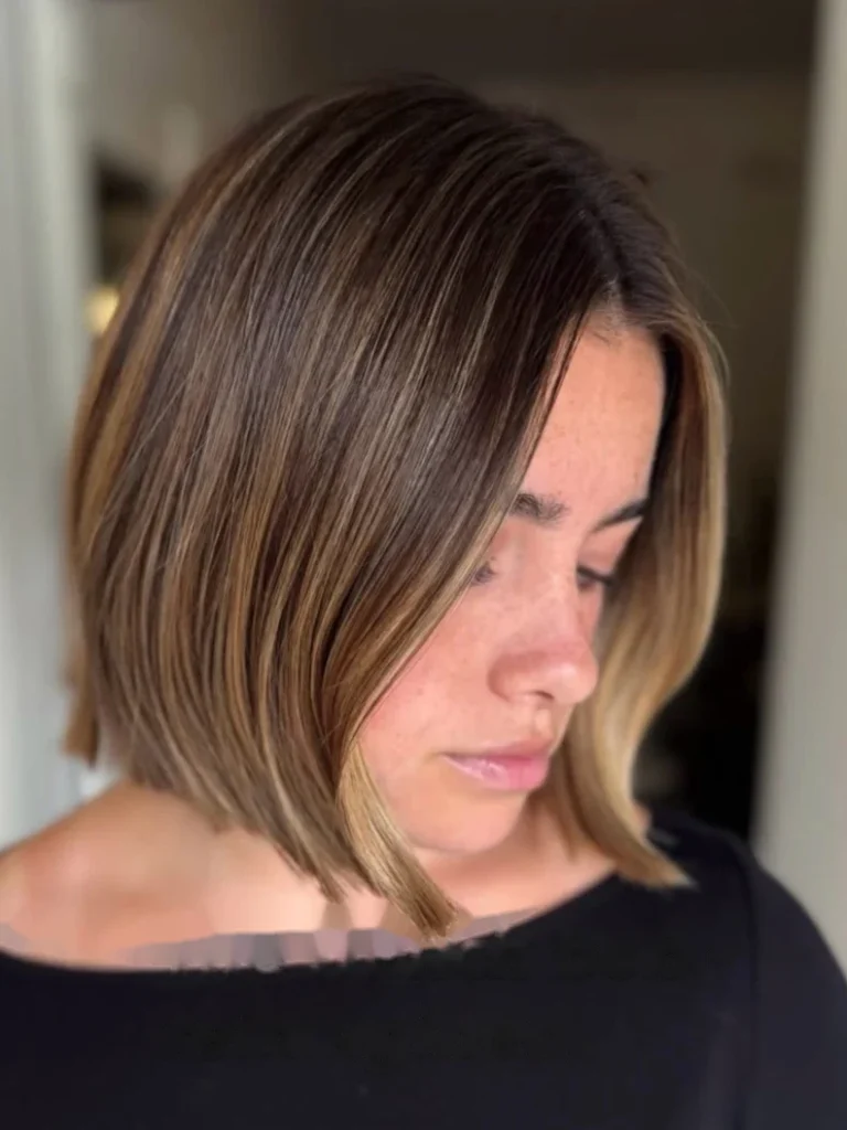 Angled layered bob in brown with caramel highlights